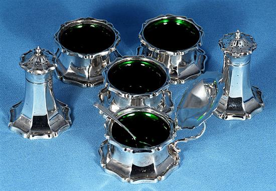 An Art Nouveau George V silver six piece cruet set, pepper height 82mm, weight 10.1oz/317grms.